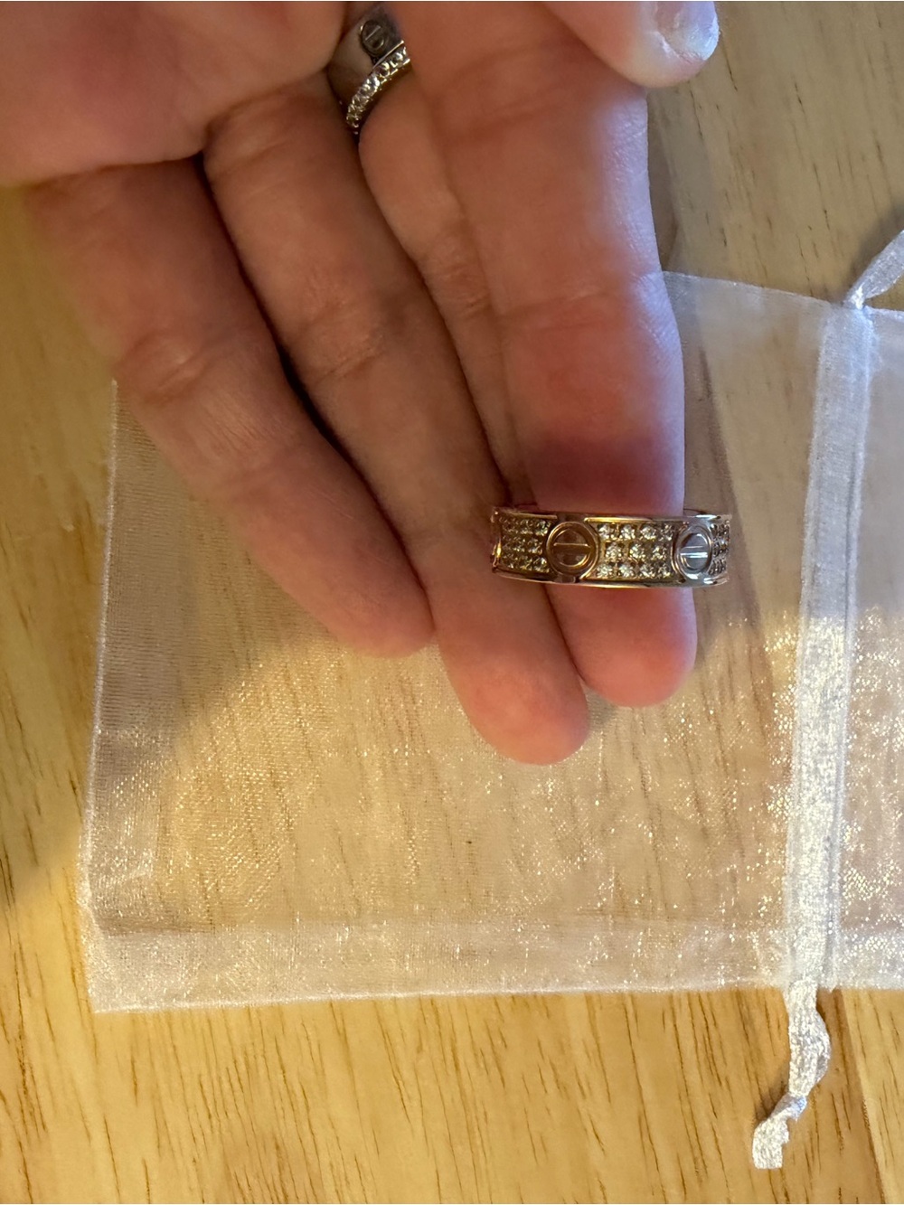 Gold-Tone Pavรฉ Crystal Band Ring with Signature Motif